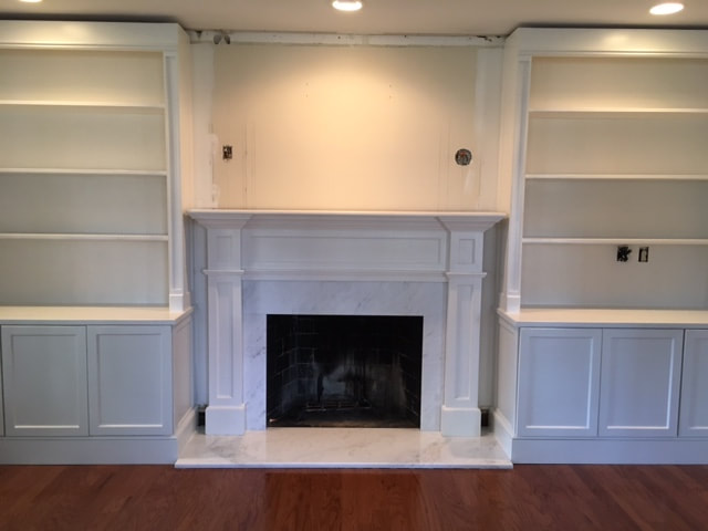 Fireplace and built into wall shelves