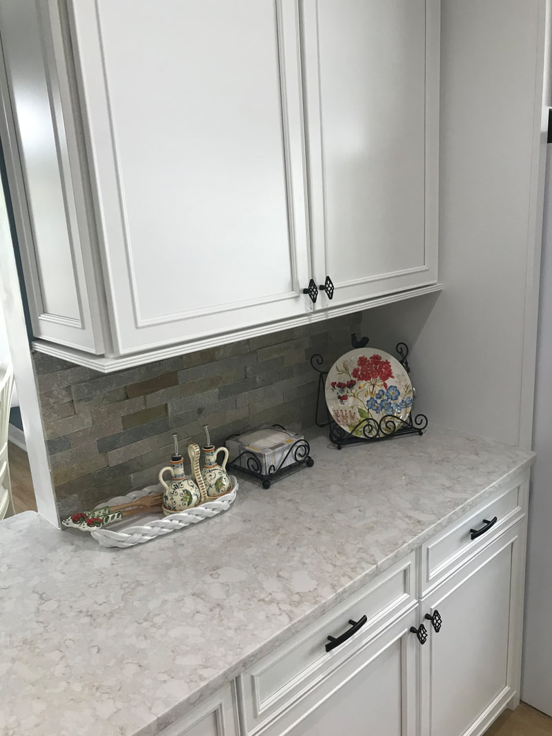 Kitchen counter with stone backsplash